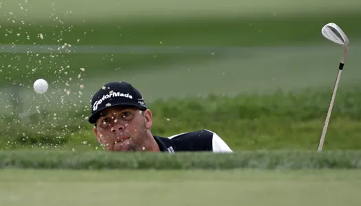 Michael Block hits out of the bunker on the first hole during the first round of the PGA Championship golf tournament at Valhalla Golf Club on Thursday, Aug. 7, 2014, in Louisville, Ky. (AP Photo/David J. Phillip)